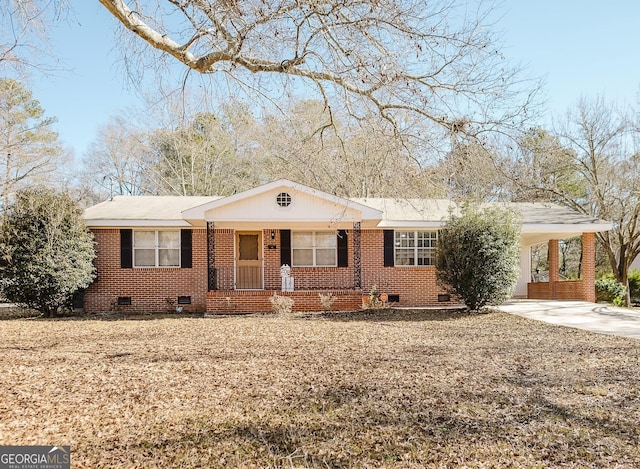 ranch-style house with a carport and covered porch