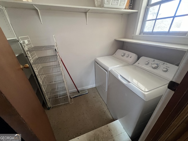 clothes washing area featuring independent washer and dryer