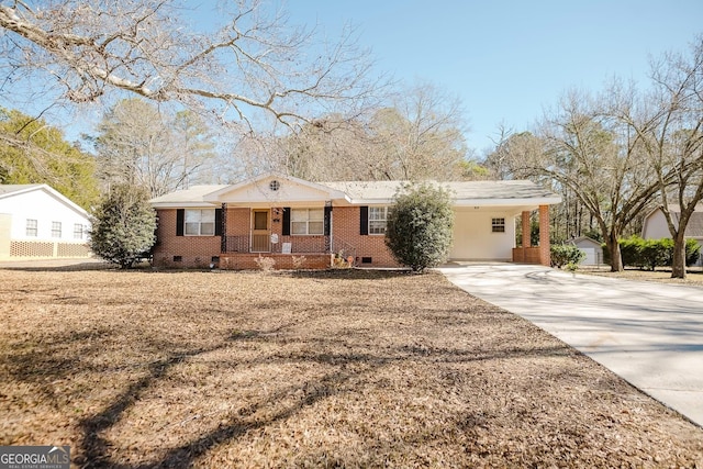 ranch-style home with a porch and a carport