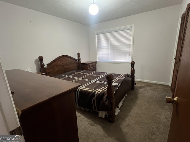 carpeted bedroom featuring a closet