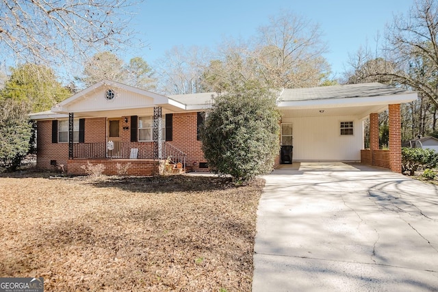 view of front of home with a carport and covered porch