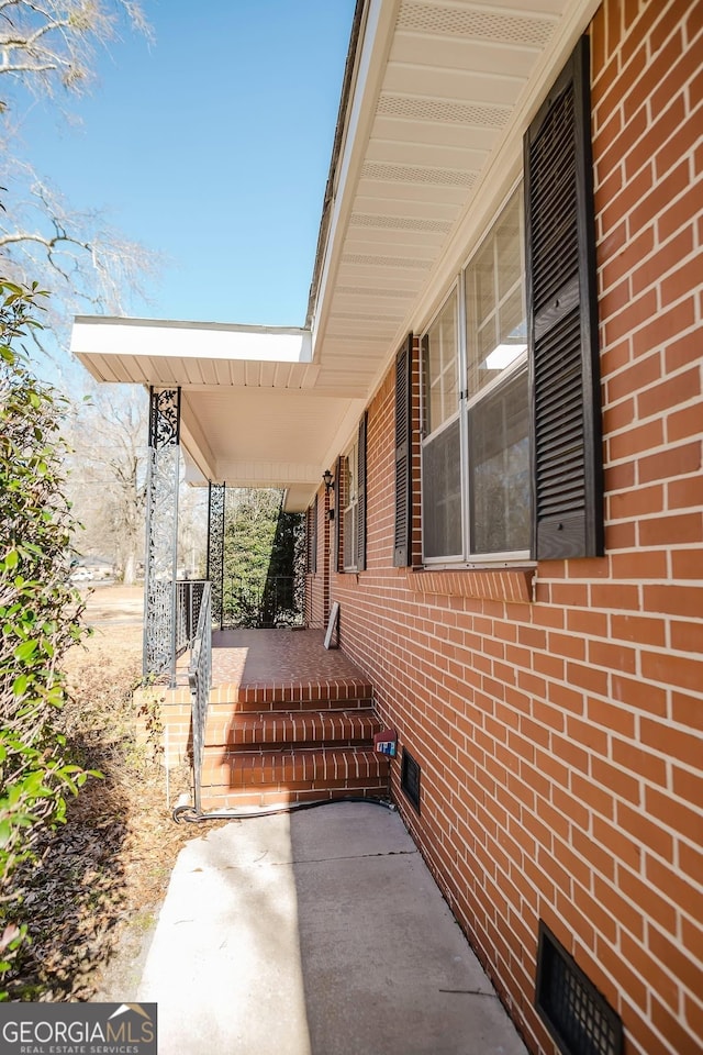 view of side of property featuring a porch