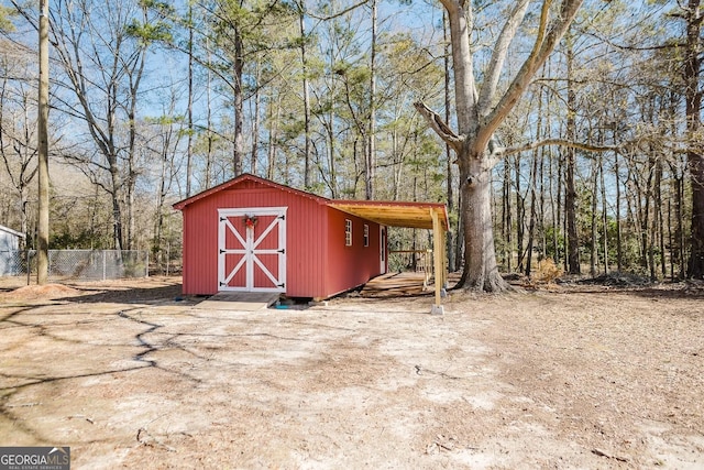 view of outbuilding with a carport