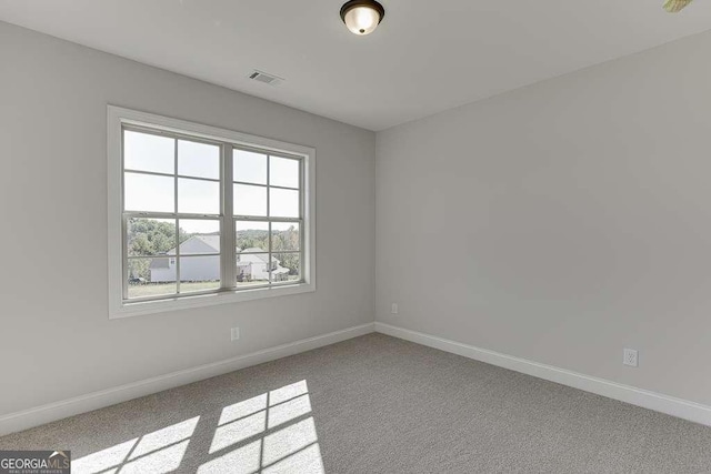 empty room with light colored carpet