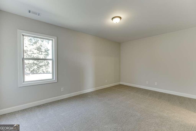 view of carpeted spare room