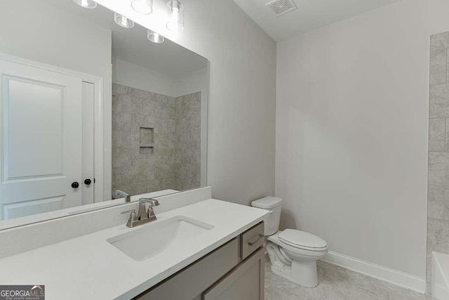 bathroom with tile patterned floors, vanity, and toilet