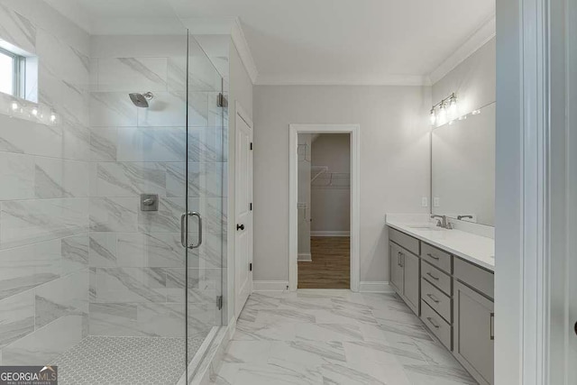 bathroom with vanity, walk in shower, and ornamental molding