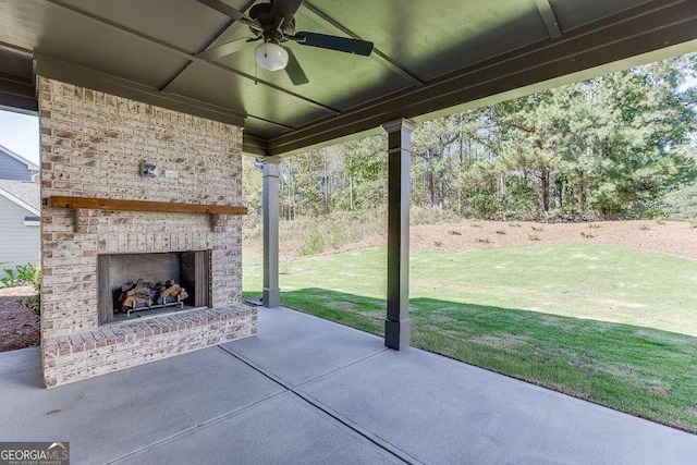 view of patio / terrace featuring an outdoor brick fireplace and ceiling fan