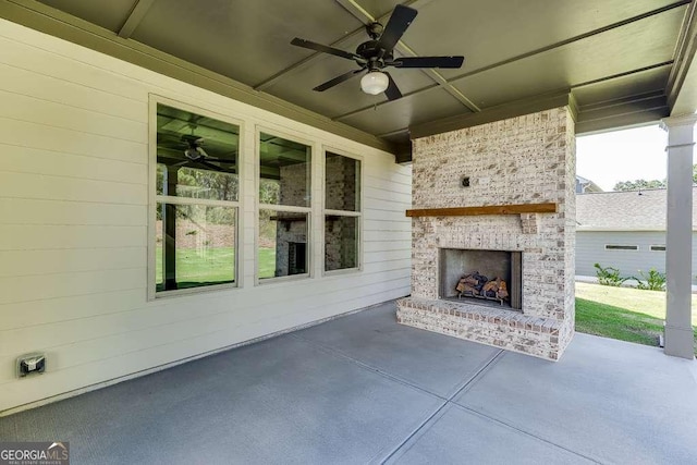 view of patio / terrace with ceiling fan and an outdoor brick fireplace