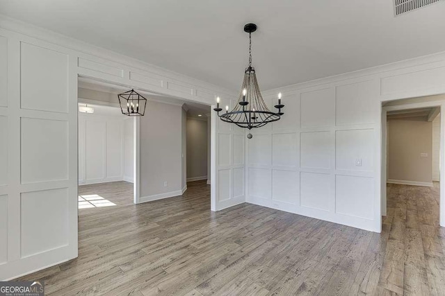 unfurnished dining area with light hardwood / wood-style flooring