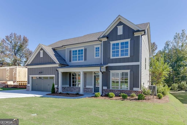 craftsman-style home featuring a front yard, a porch, and a garage