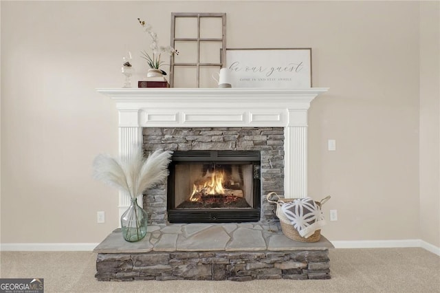 room details featuring a fireplace and carpet