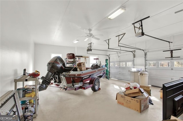 garage with ceiling fan and a garage door opener