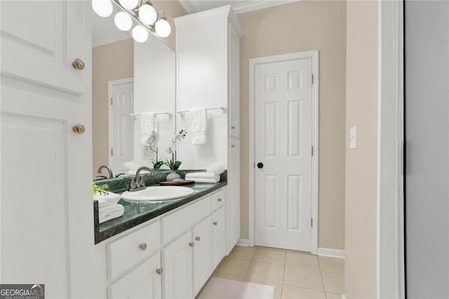 bathroom with tile patterned flooring, vanity, and ornamental molding