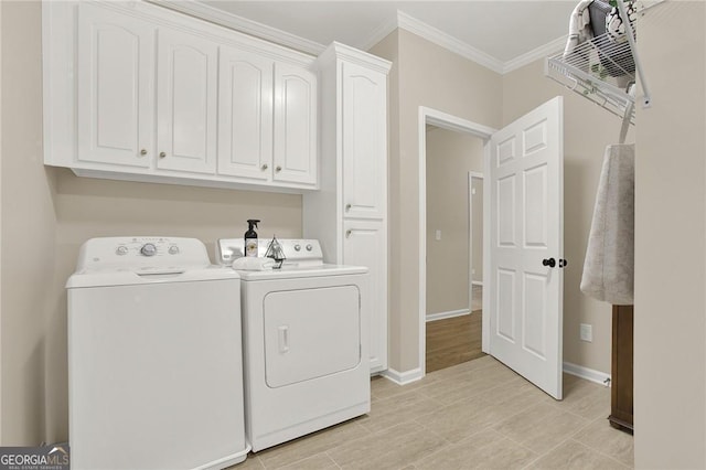 clothes washing area featuring cabinets, separate washer and dryer, and ornamental molding