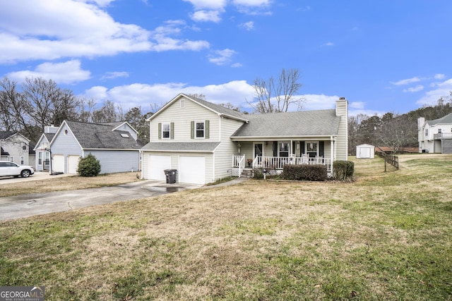 tri-level home with a front yard, a porch, a garage, and a storage unit