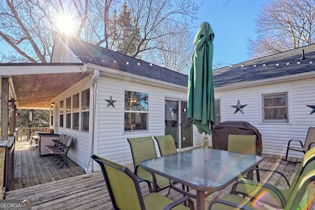 wooden terrace featuring a grill