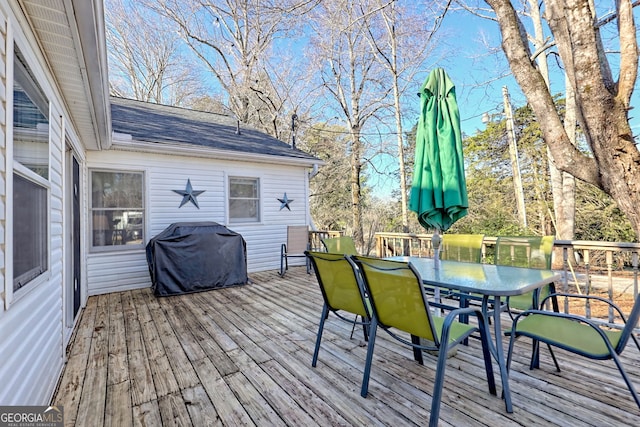 wooden terrace with area for grilling