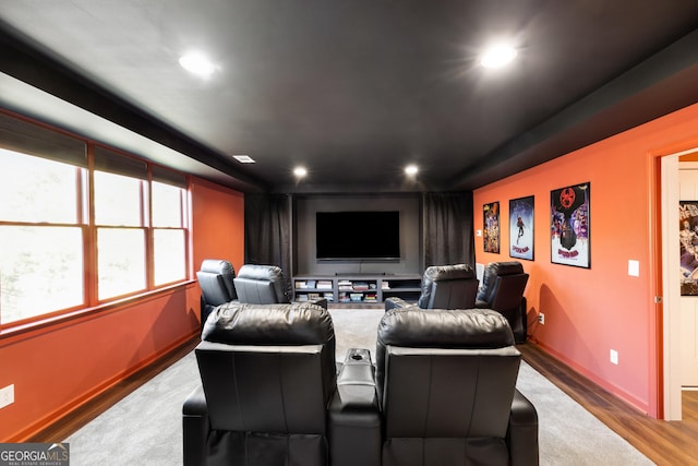 home theater room featuring light hardwood / wood-style floors