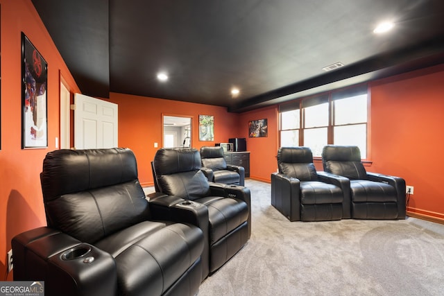 home theater with light colored carpet