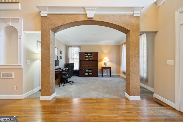 office area with carpet floors and ornamental molding