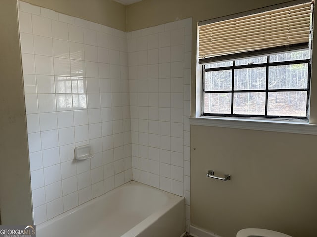 full bathroom with  shower combination and toilet