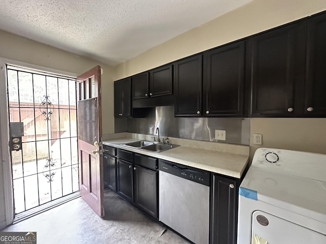 kitchen featuring dark cabinets, a sink, light countertops, dishwasher, and washer / dryer