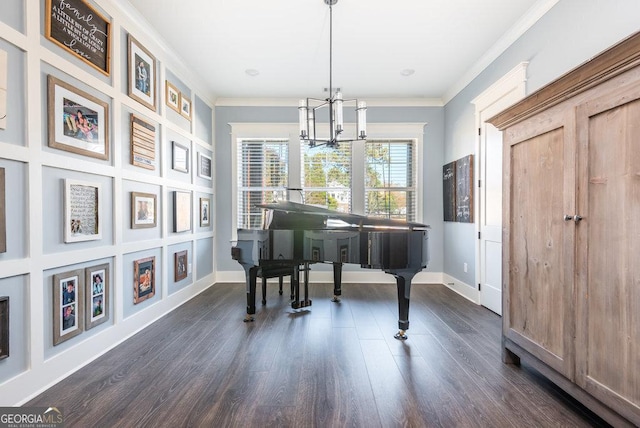 misc room with dark hardwood / wood-style flooring, an inviting chandelier, and ornamental molding