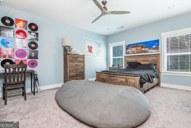 carpeted bedroom with ceiling fan