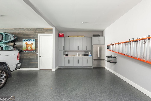 garage with wooden walls and high quality fridge