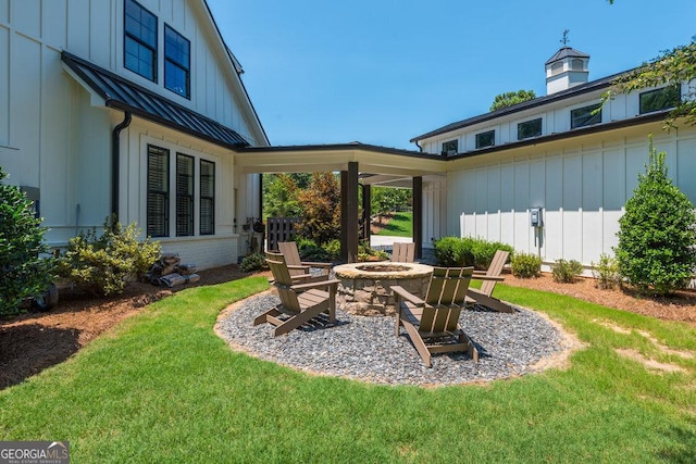 view of yard with an outdoor fire pit