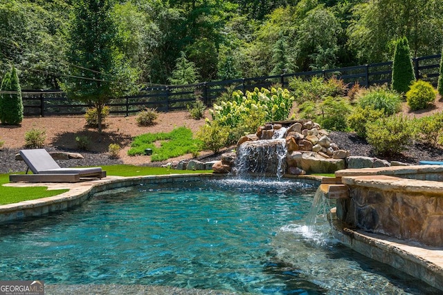 view of pool with pool water feature