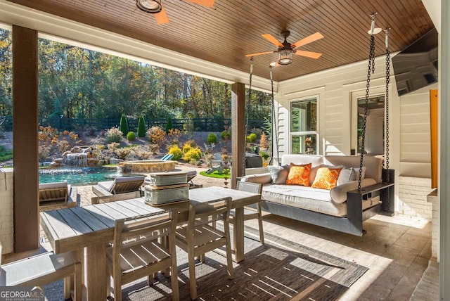 view of patio featuring ceiling fan, pool water feature, and an outdoor living space