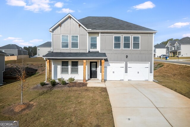 view of front facade featuring board and batten siding, driveway, a garage, and a porch