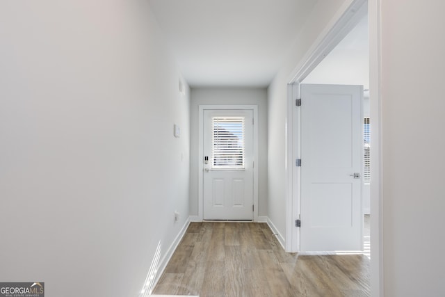 doorway to outside featuring light hardwood / wood-style flooring