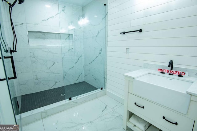 bathroom with vanity and a shower with shower door