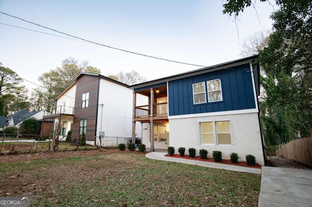 view of front of house featuring a balcony