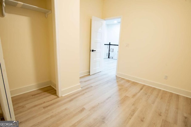 interior space with light hardwood / wood-style flooring and a closet