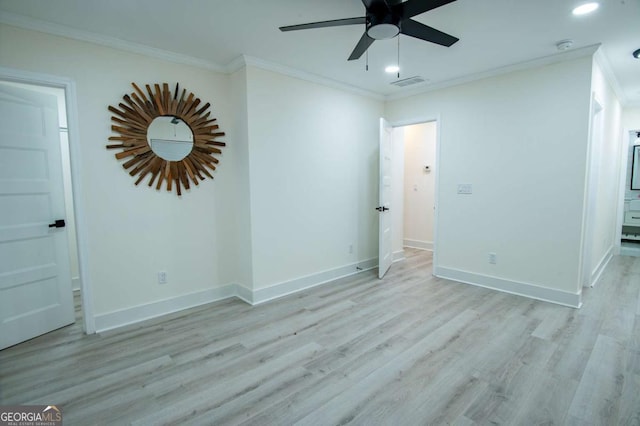 unfurnished room with light hardwood / wood-style flooring, ceiling fan, and ornamental molding