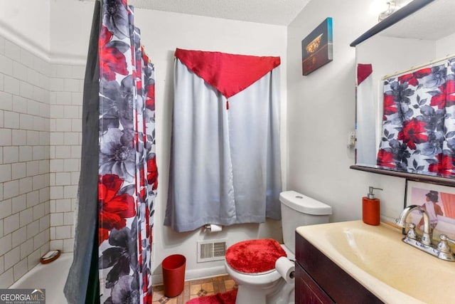 bathroom with toilet, vanity, a textured ceiling, and a shower with shower curtain