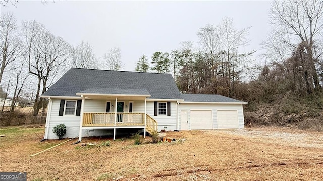 view of front of house featuring a porch and a garage