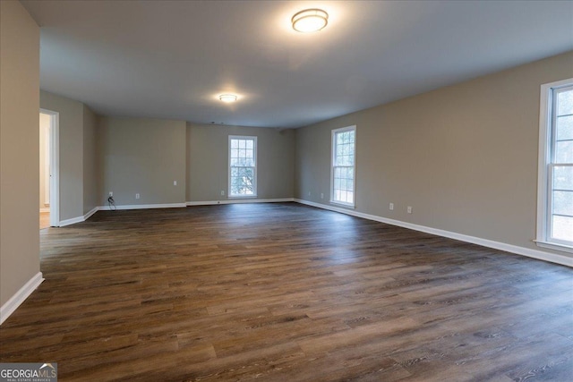 spare room with dark hardwood / wood-style floors