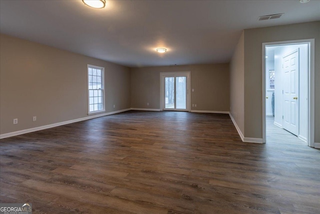 spare room with dark hardwood / wood-style flooring