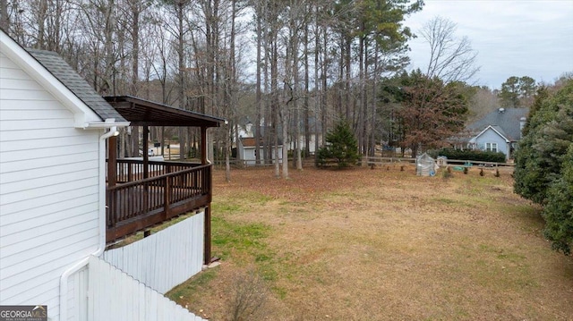 view of yard with a wooden deck