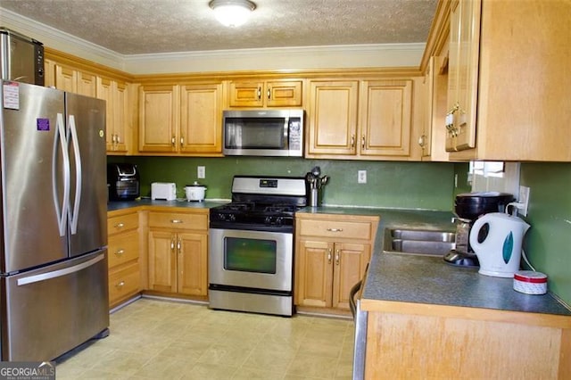 kitchen featuring a textured ceiling, stainless steel appliances, crown molding, and sink