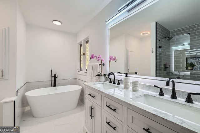 bathroom featuring vanity and plus walk in shower