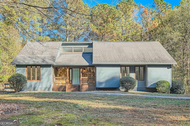 view of front of home with a front lawn and a porch