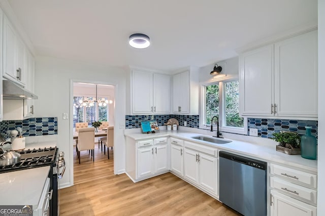 kitchen with white cabinetry, appliances with stainless steel finishes, sink, and plenty of natural light