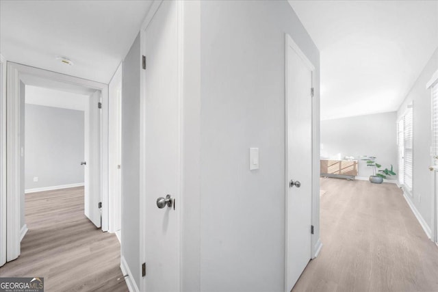 corridor featuring light hardwood / wood-style floors