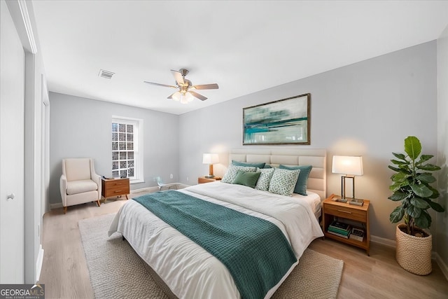 bedroom featuring light hardwood / wood-style flooring and ceiling fan